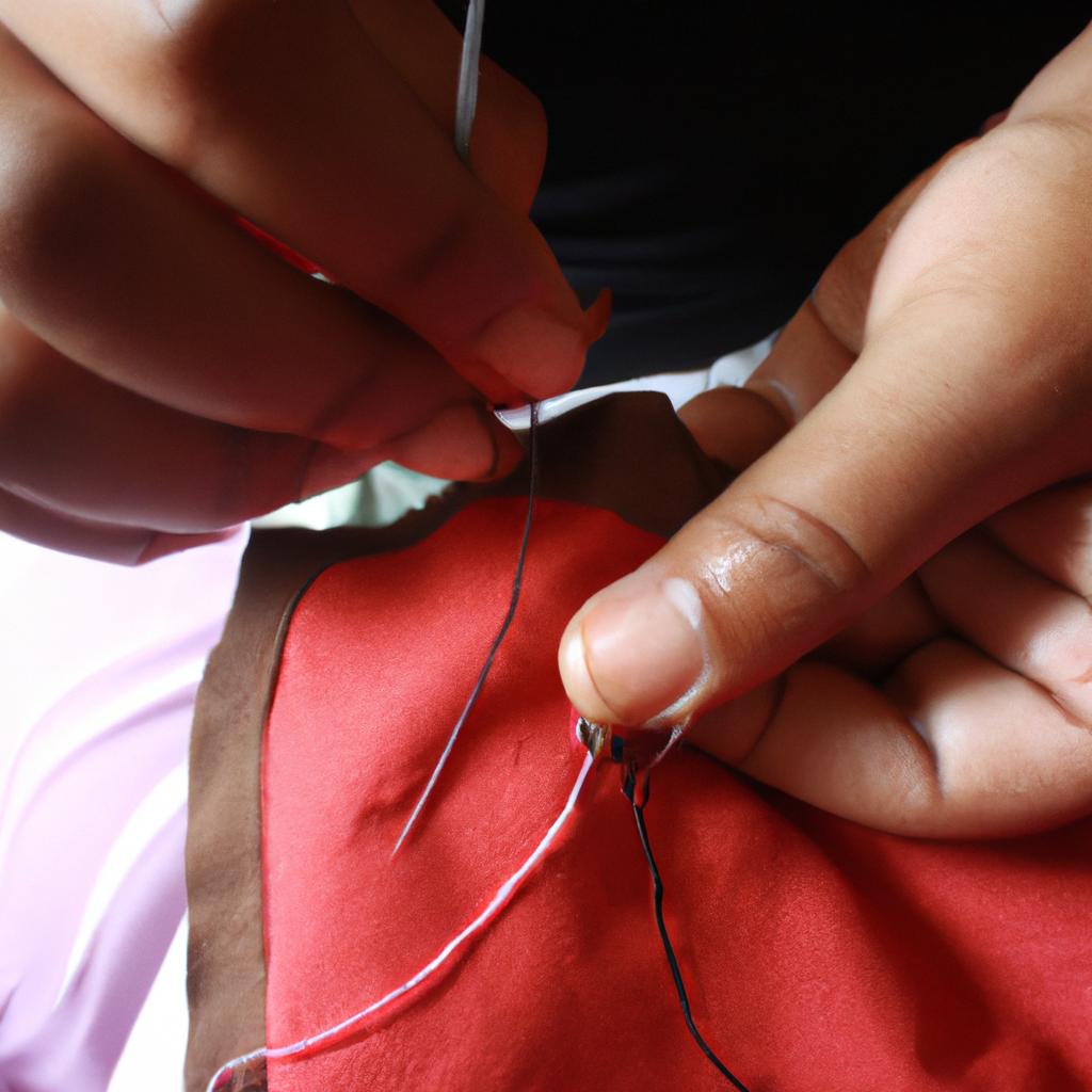 Person stitching with needle and thread