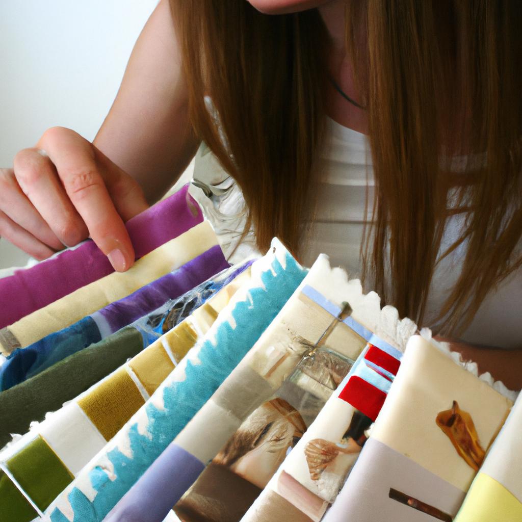 Person choosing fabric for cross-stitch