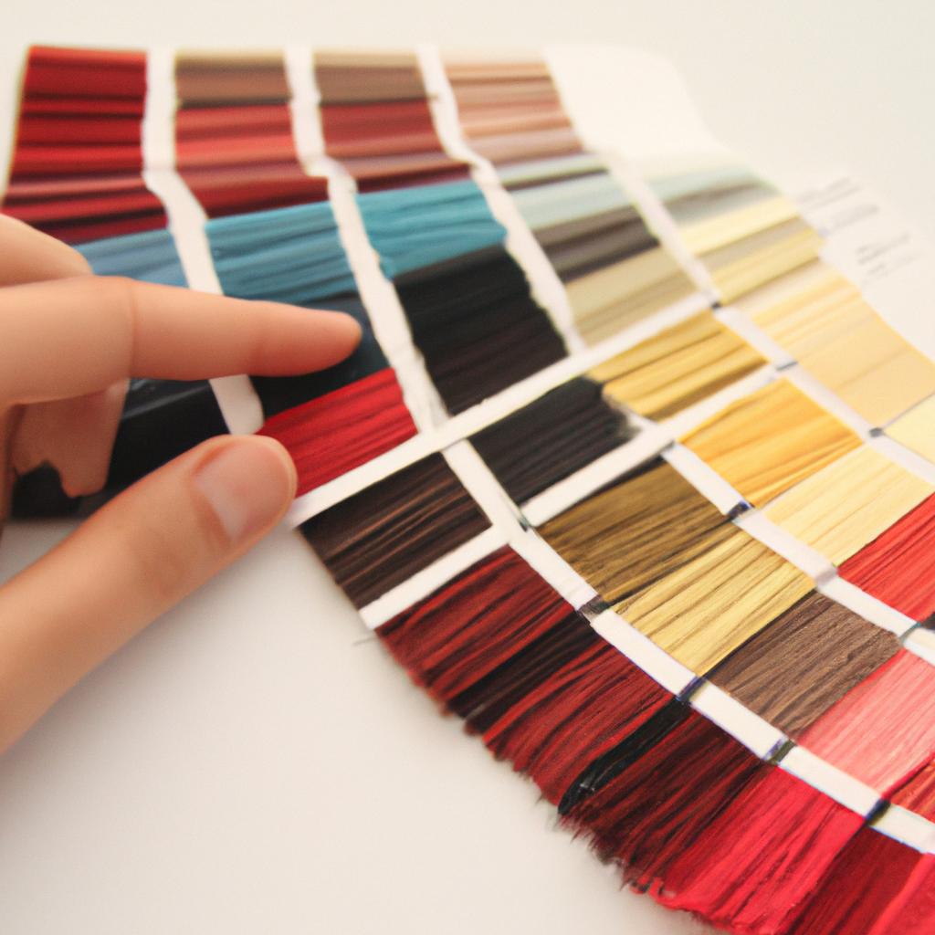 Person selecting thread color swatches