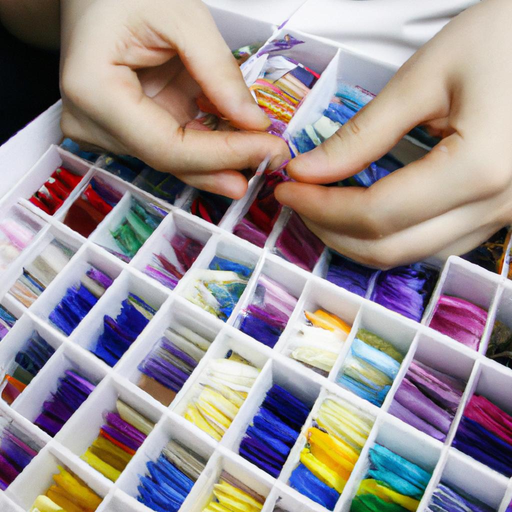 Person selecting cross stitch threads